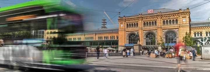 ÜSTRA bus driving in front of Hanover central station by day